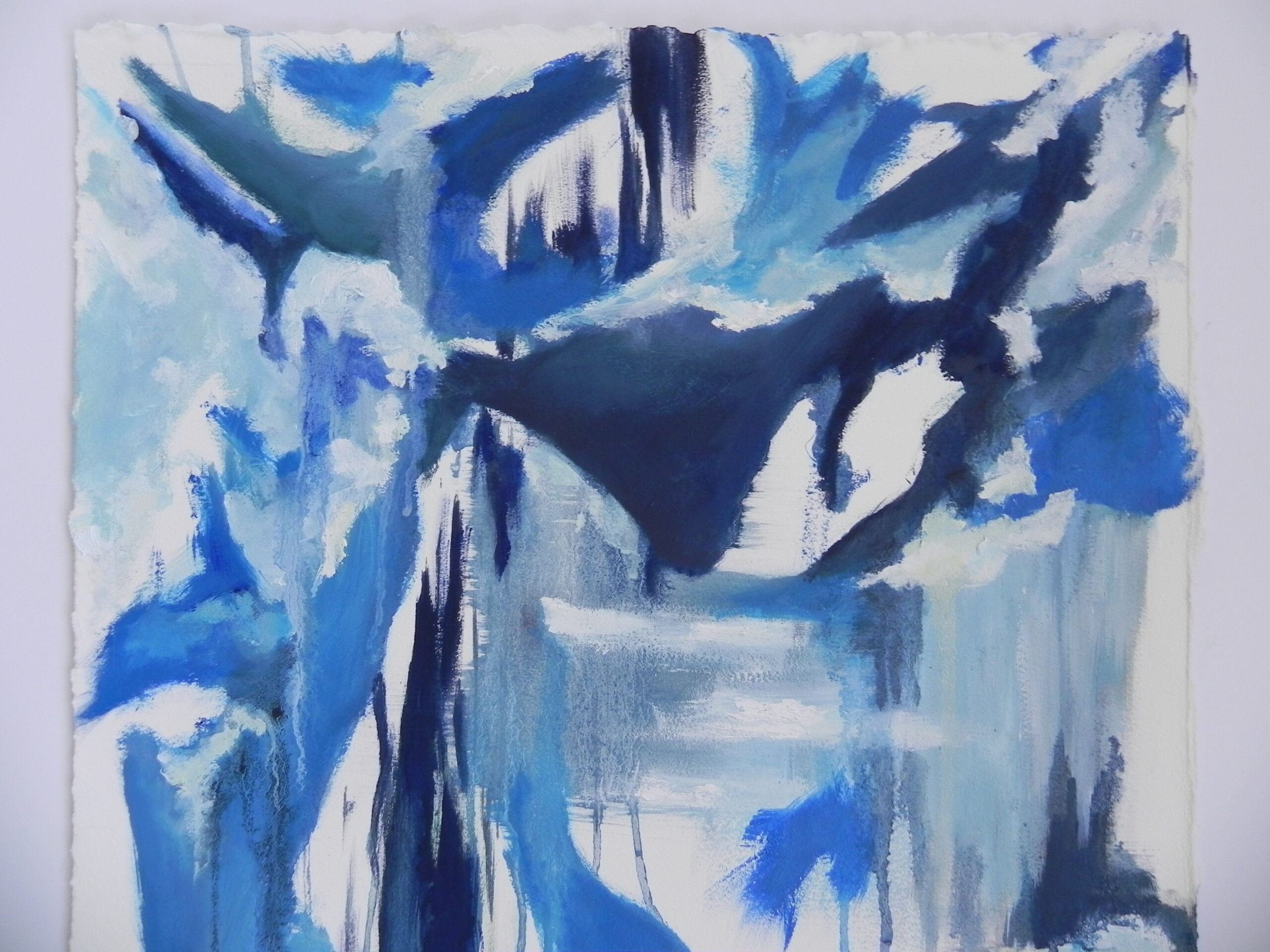 Abstract blue and white acrylic painting on textured paper with bold brushstrokes