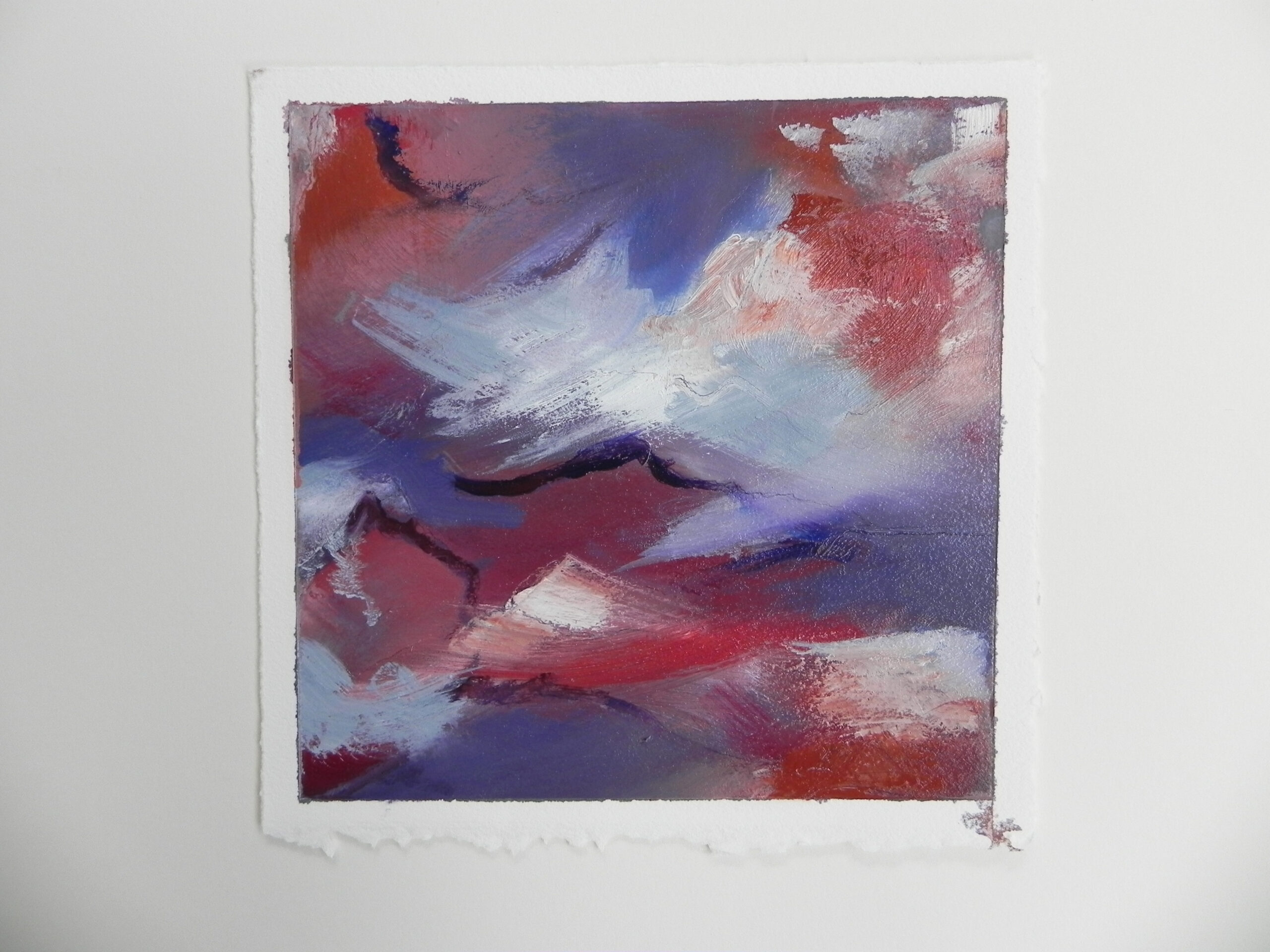 Abstract painting with red, blue, and white brushstrokes on textured paper
