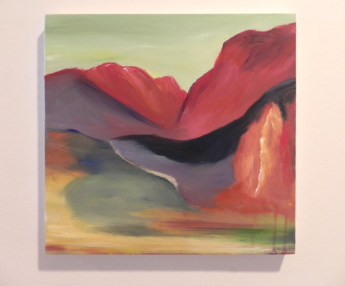 Abstract landscape painting featuring red mountains, a dark river, and green hills on canvas