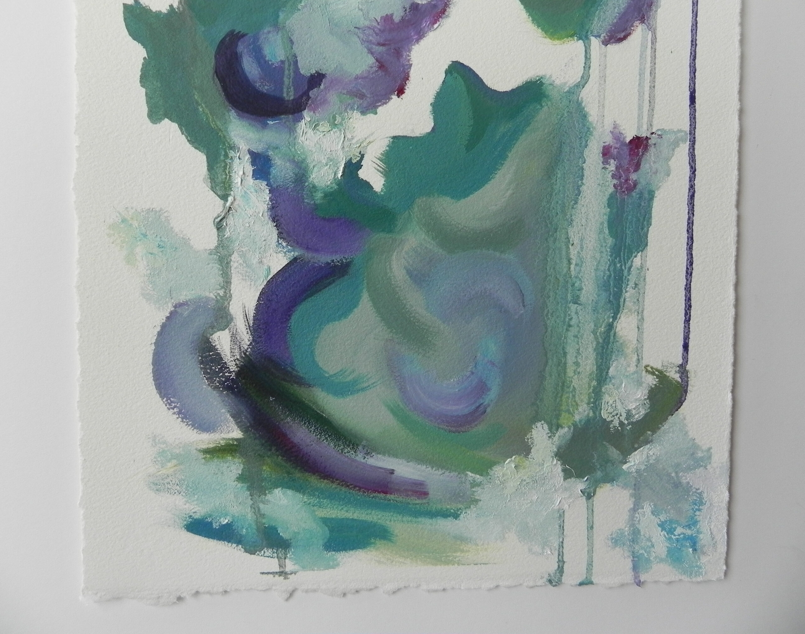 Abstract watercolor painting with green, blue, and purple swirls on textured white paper