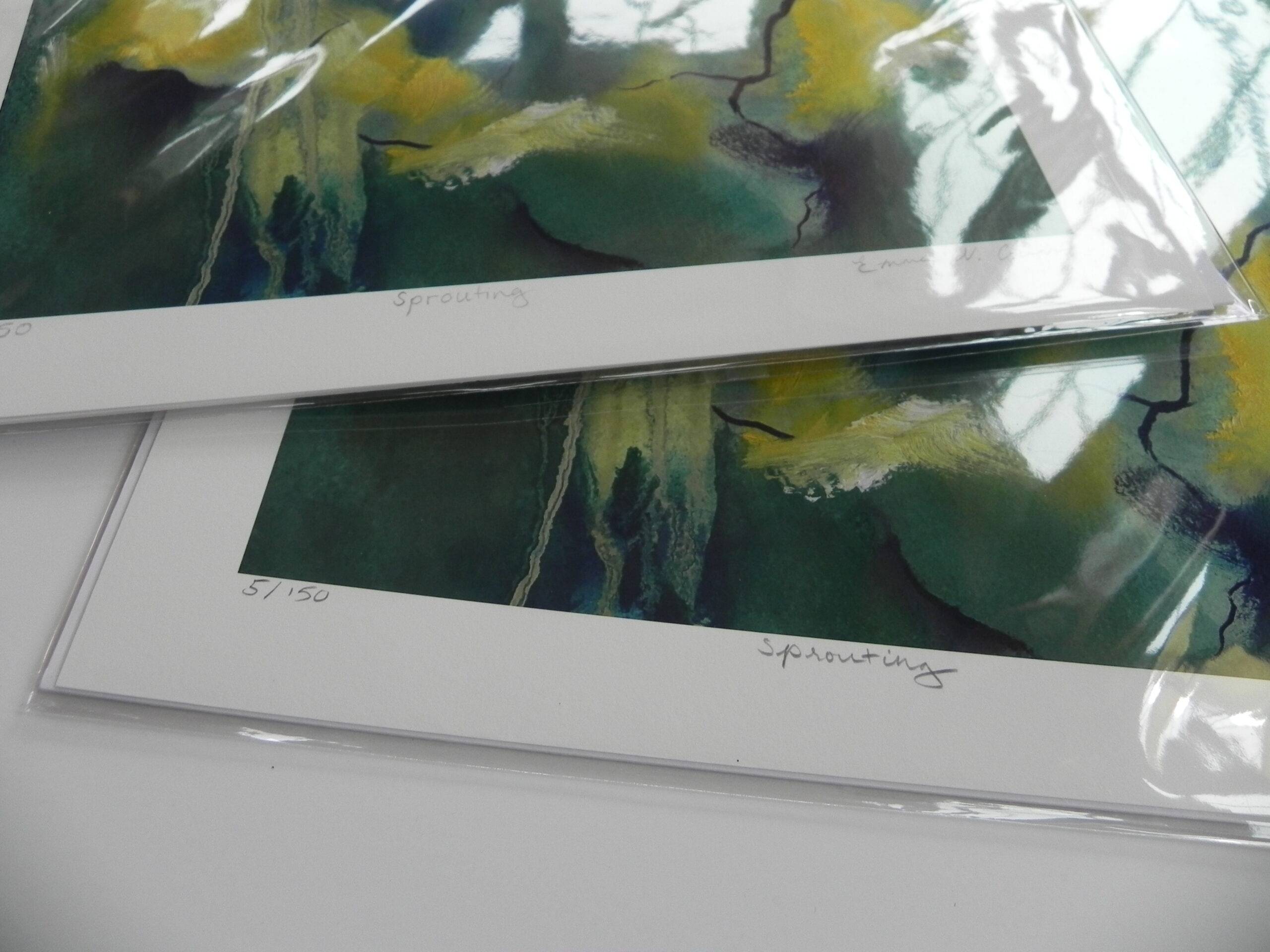 Limited edition art print Sprouting showing green and yellow abstract landscape in plastic sleeve