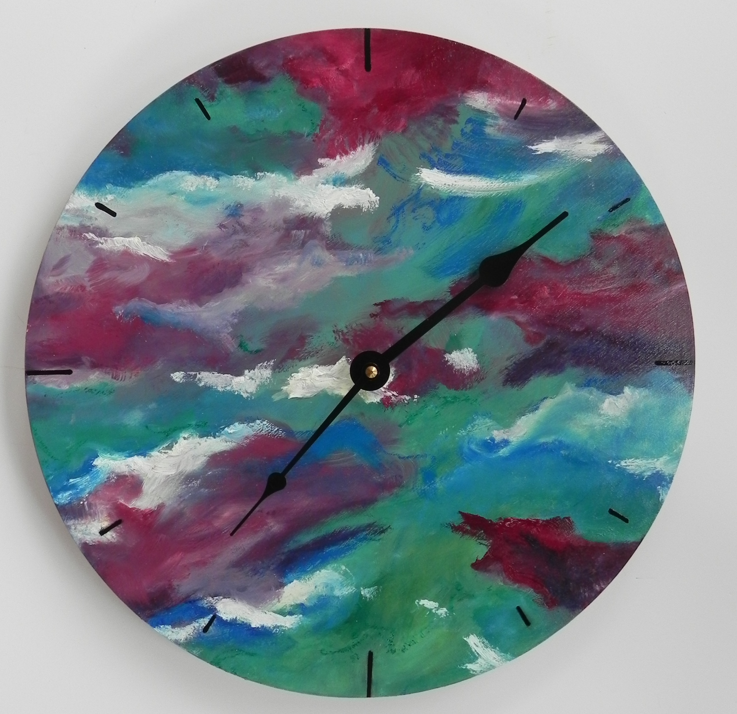 Abstract painted wall clock with swirling pink, teal, and blue colors and black hands