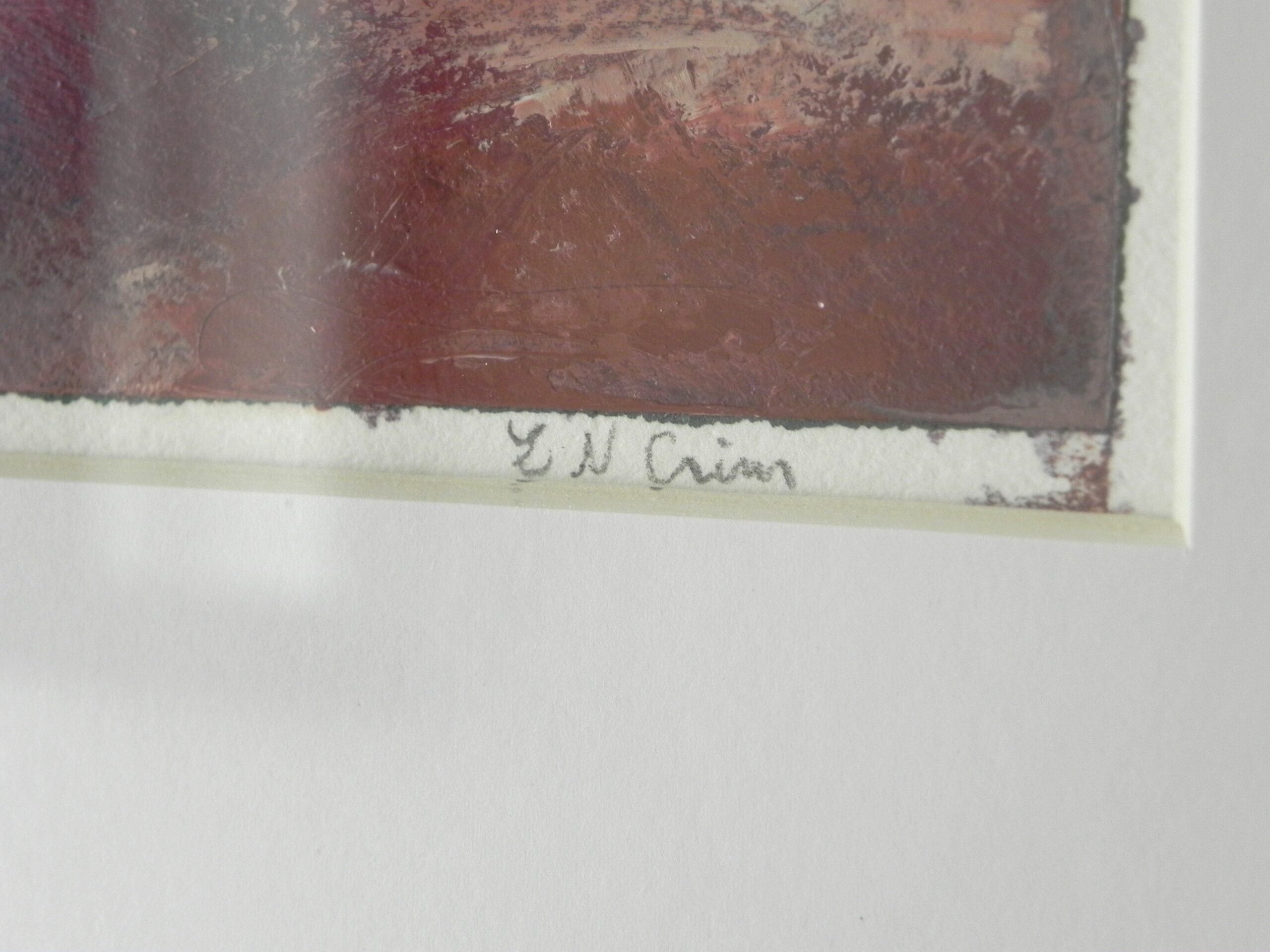 Close-up of textured reddish-brown artwork corner with E N Crain signature on white mat border