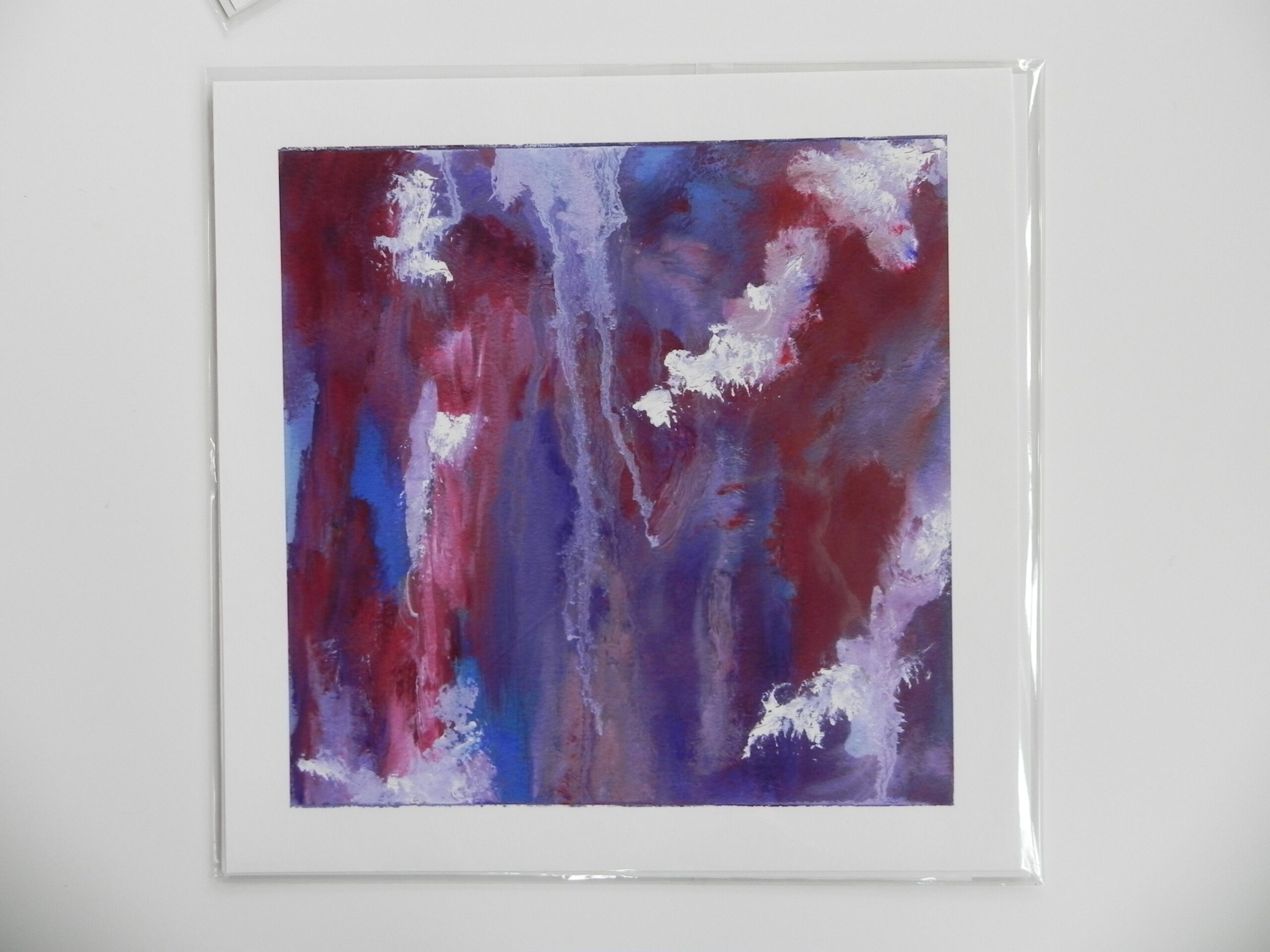 Abstract art print featuring vertical brushstrokes in deep red, purple, and blue with white accents, mounted on white cardstock.