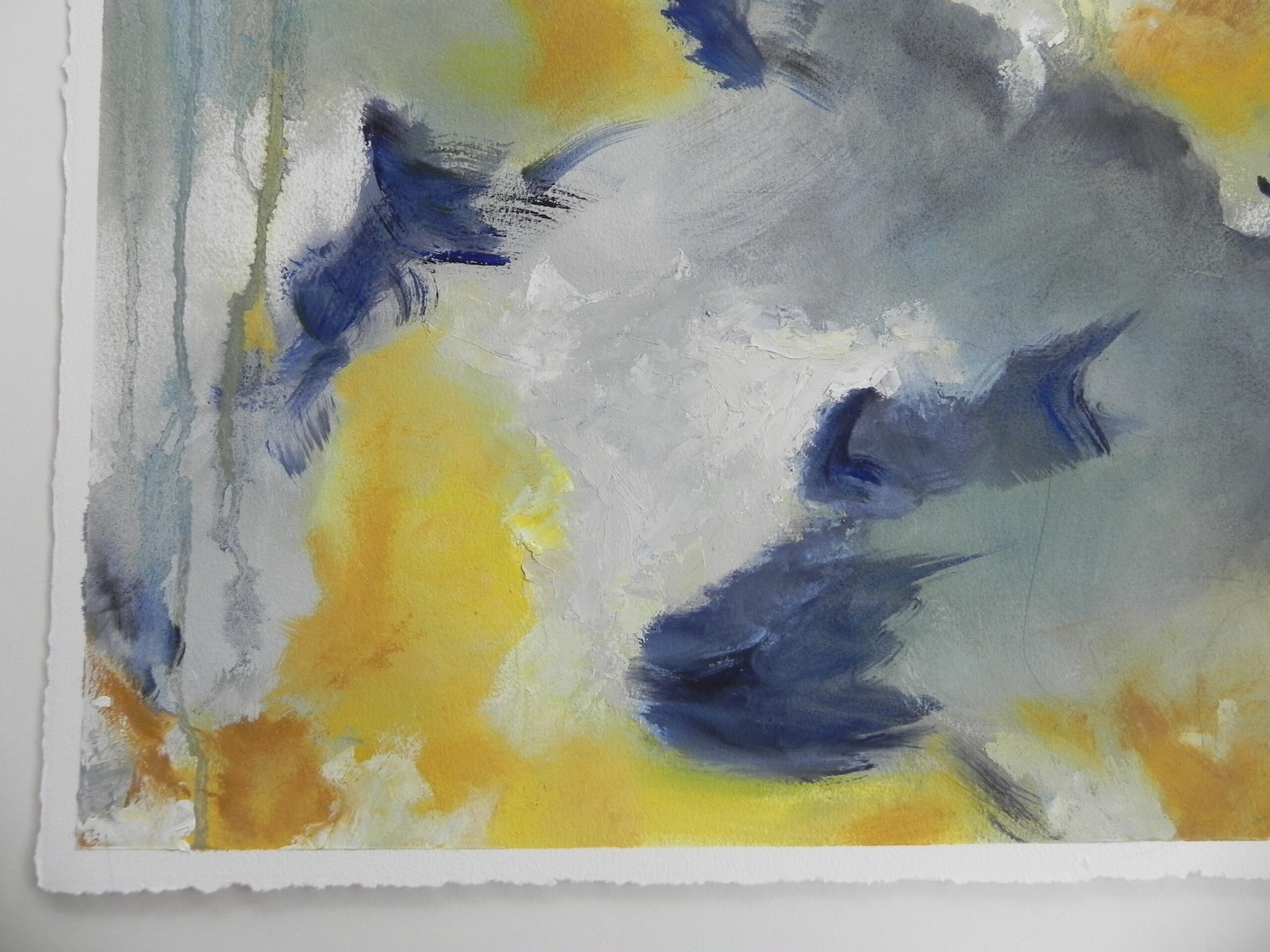 Abstract watercolor painting with blue, yellow, and gray brushstrokes on textured white paper