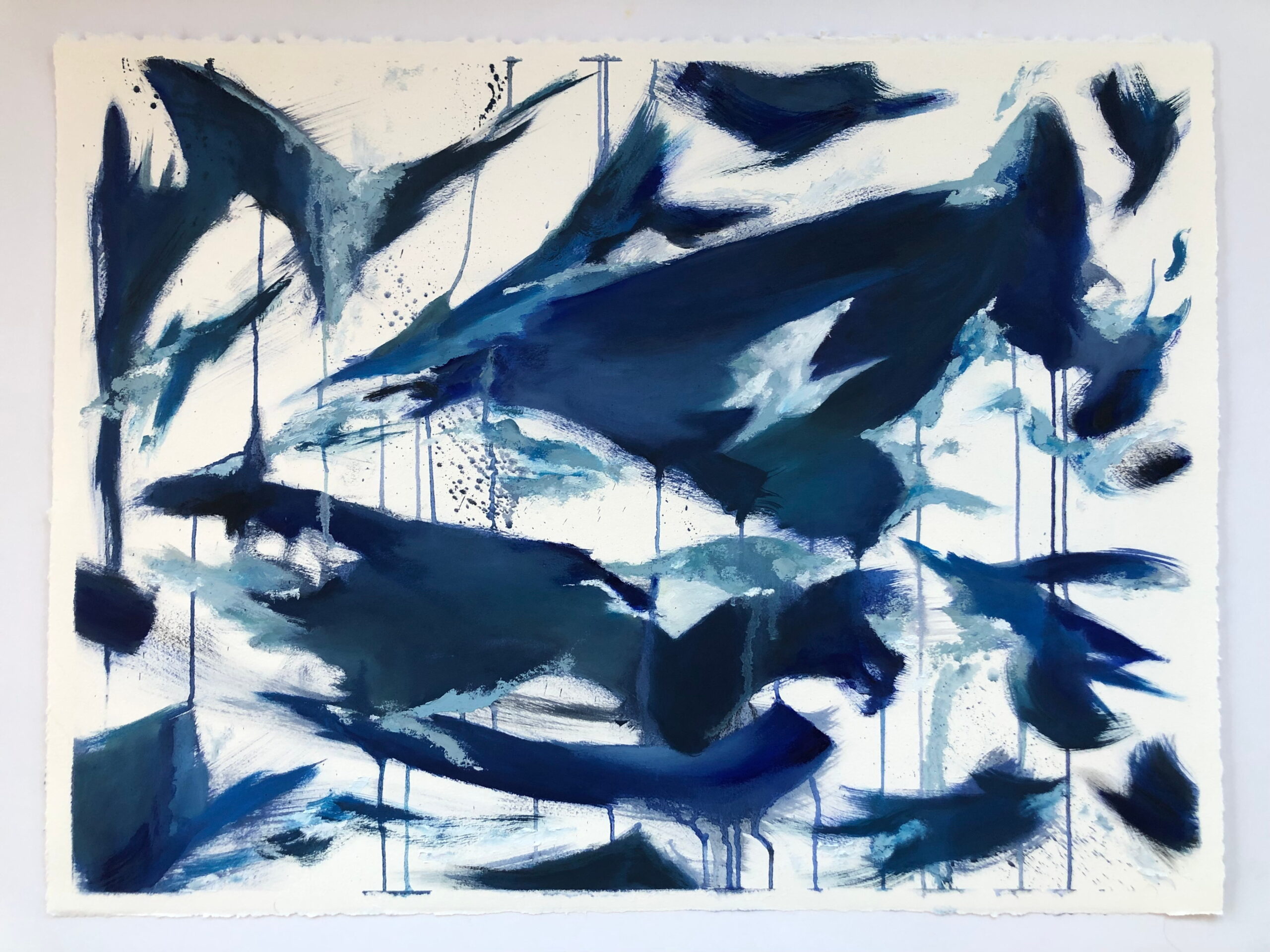 Abstract blue and white acrylic painting with dynamic brushstrokes and drips on textured paper