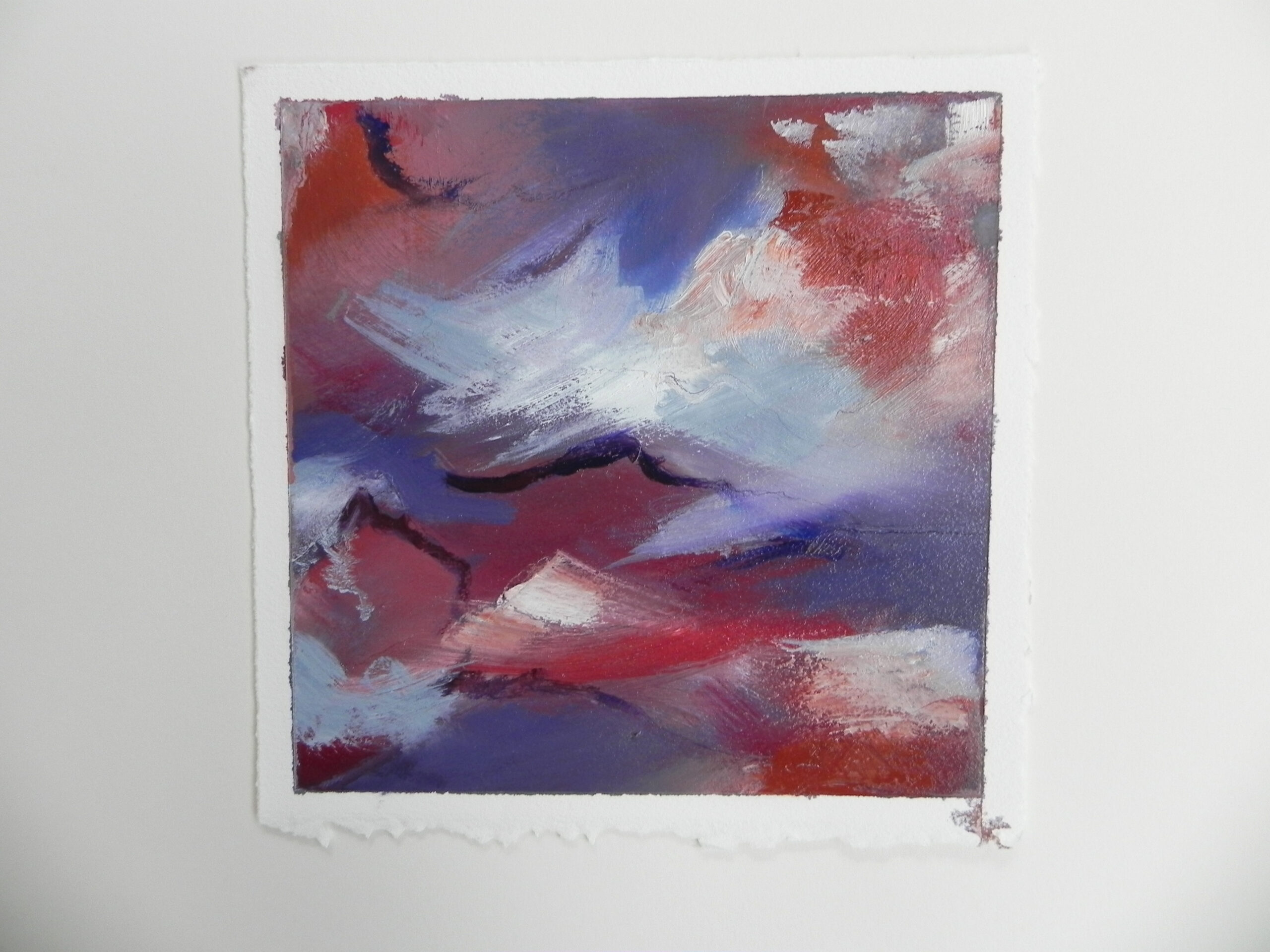 Abstract painting with red, blue, and white brushstrokes on textured paper