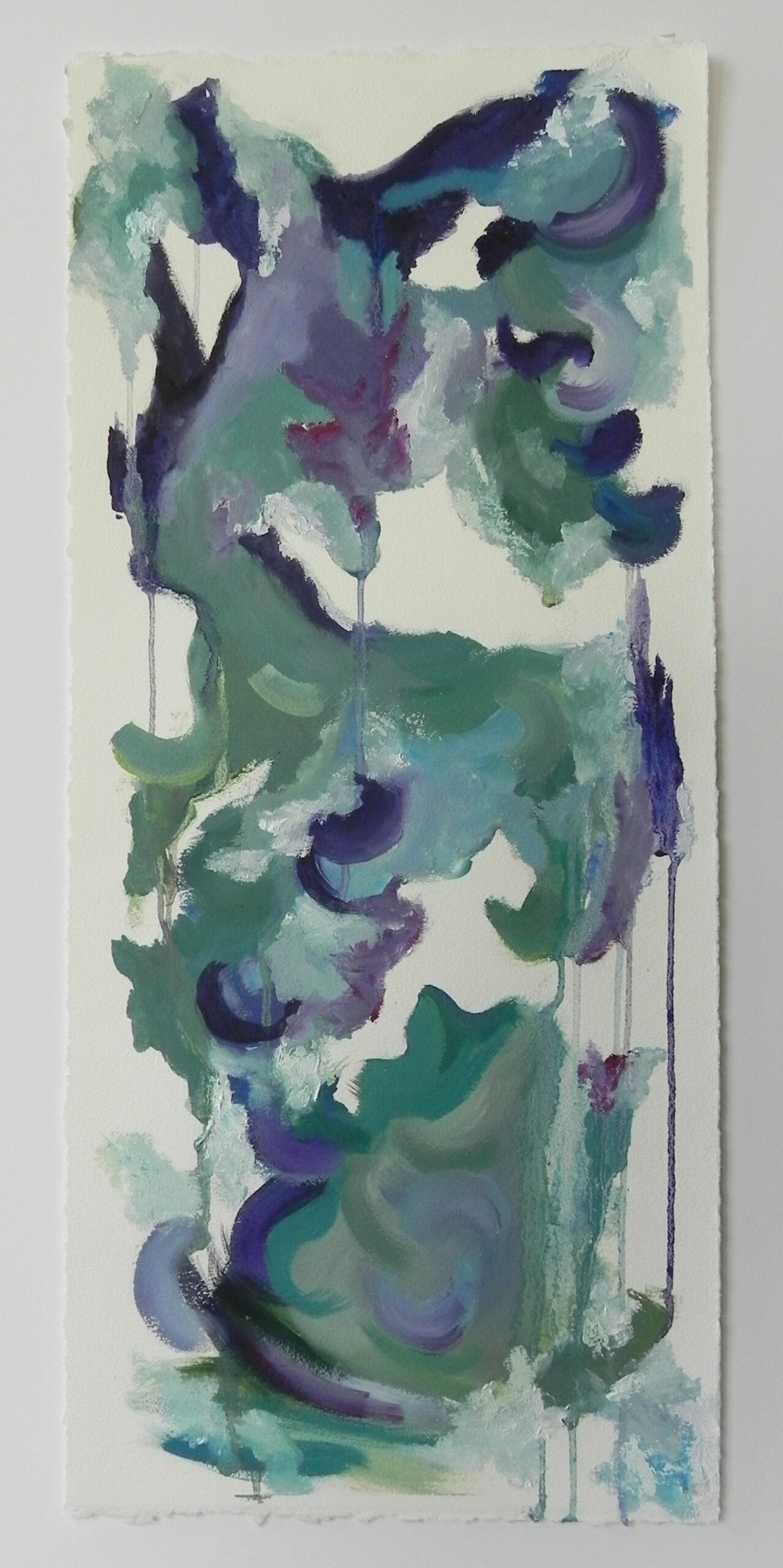 Abstract watercolor painting with green, blue, and purple swirls on textured white paper