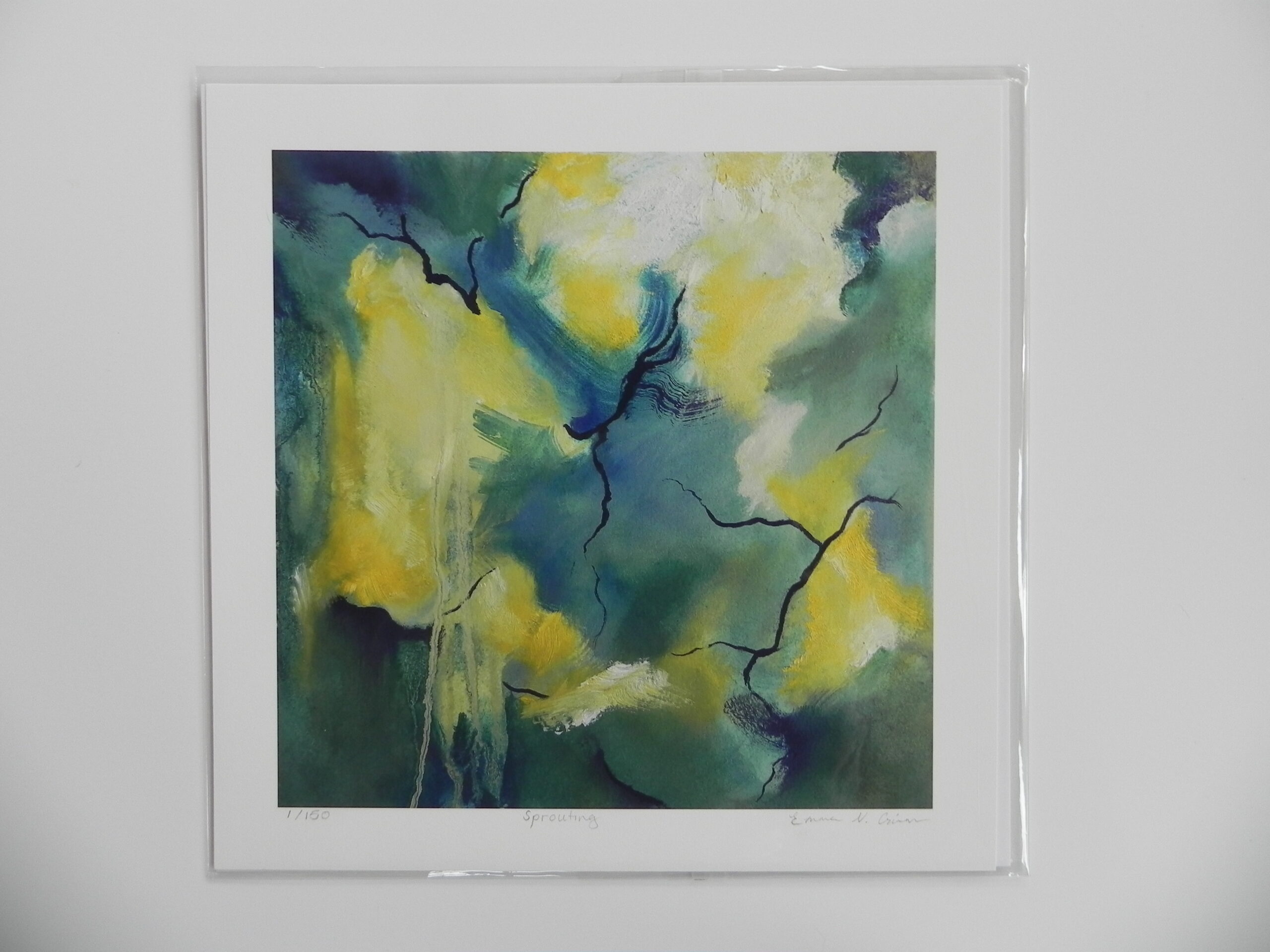 Abstract art print titled Sprouting featuring yellow and green hues with black lines, signed by Emma N. Crain