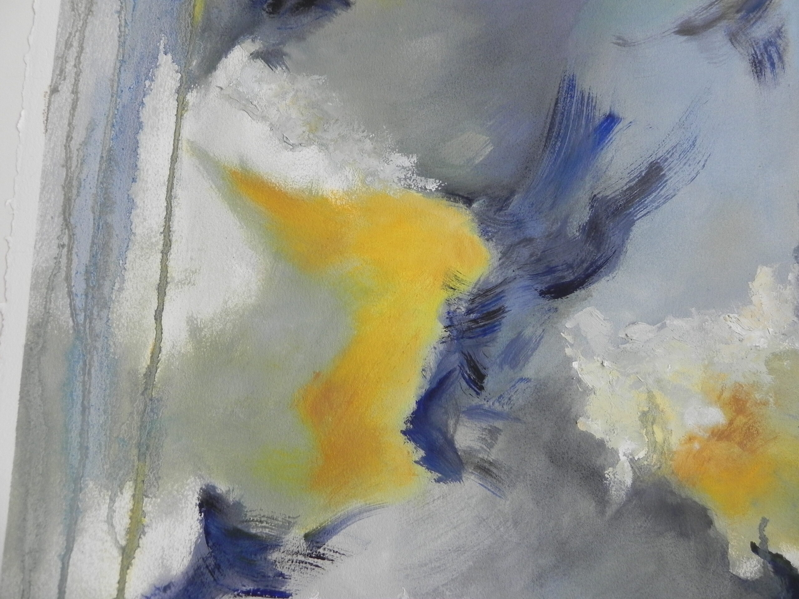Abstract painting with yellow, blue, and grey brushstrokes on textured paper